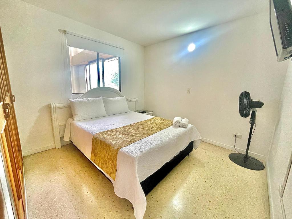 Postel nebo postele na pokoji v ubytování Hotel Torre Primavera