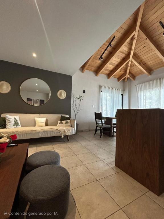 a large living room with a bed and a table at Encanto Taxqueño in Taxco de Alarcón