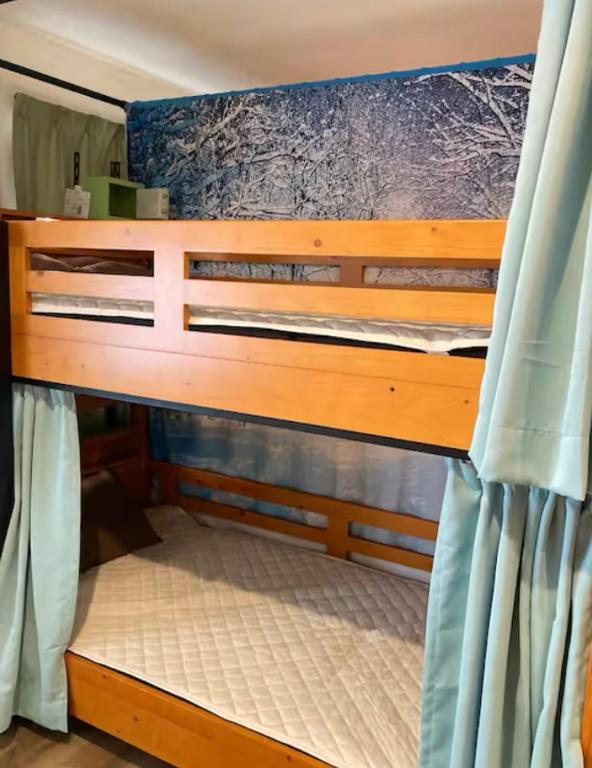 Voodi või voodid majutusasutuse Minato Hostel toas
