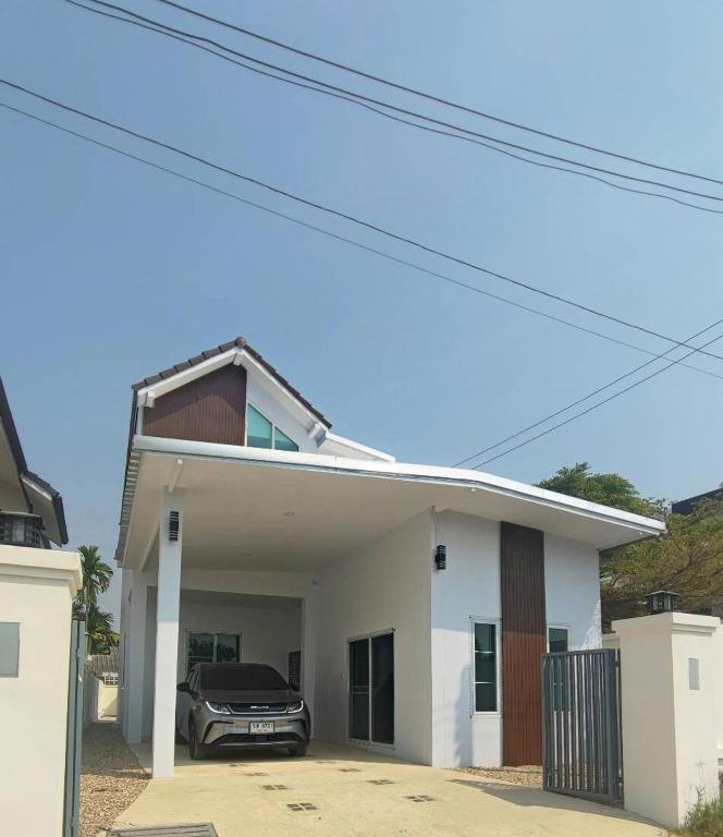 a car parked in the garage of a house at Chiangmai Love U Villas in Chiang Mai