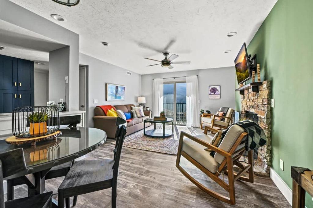 a living room with a dining table and a living room at Hesed Mountain Haven in Gatlinburg