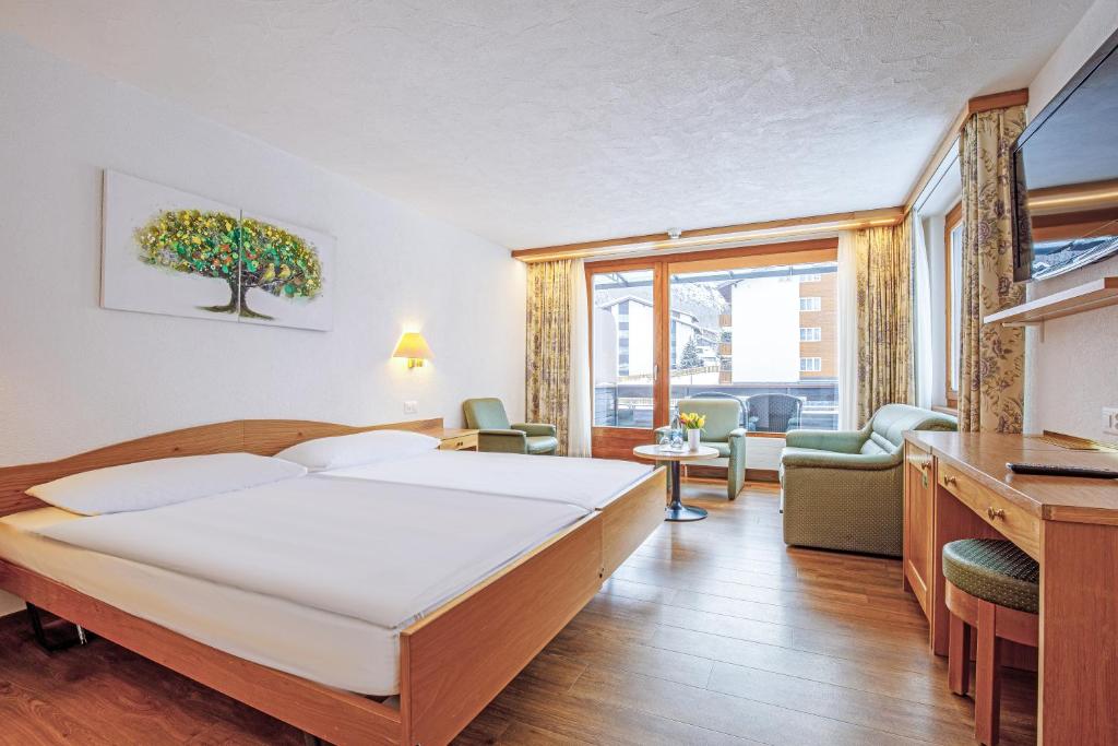 Postel nebo postele na pokoji v ubytování Hotel Alpin Superior