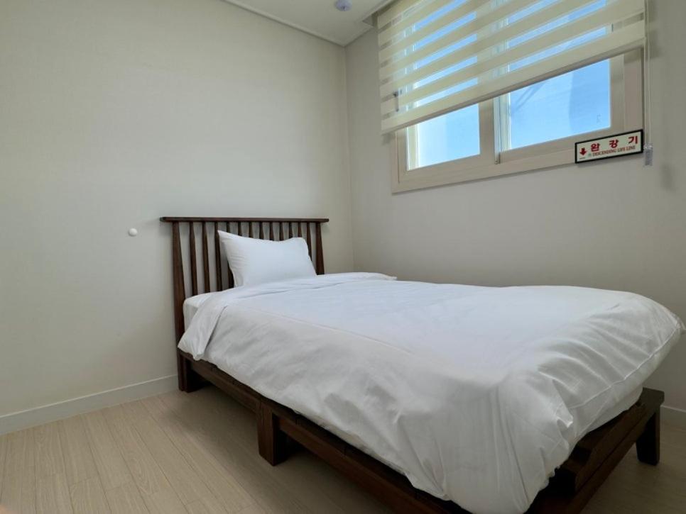 Letto o letti in una camera di Eunhasu D&M Residence