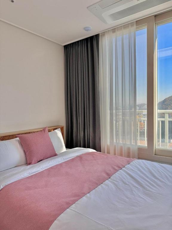 Letto o letti in una camera di Eunhasu D&M Residence