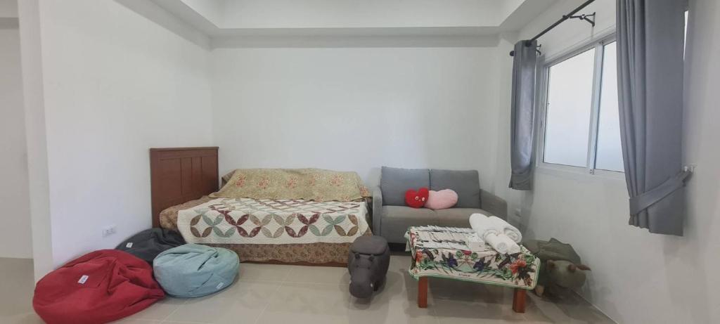 Voodi või voodid majutusasutuse Cosy Home in Koh Kaew toas