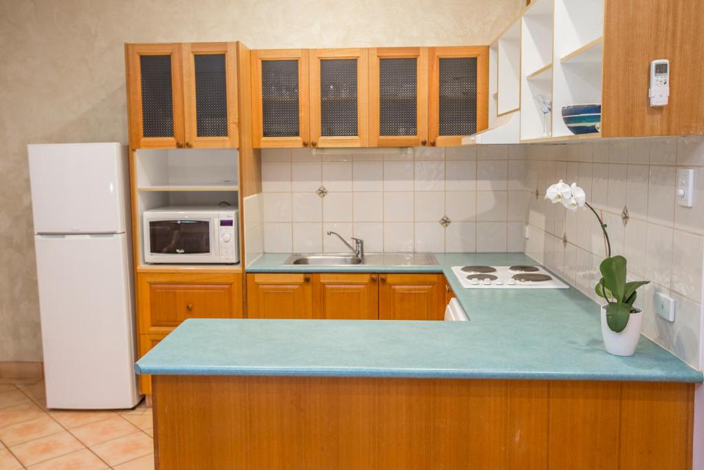 Kuchyň nebo kuchyňský kout v ubytování Blue Seas Resort