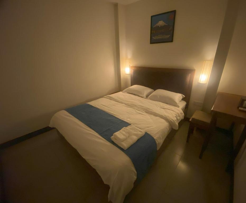 Postel nebo postele na pokoji v ubytování Hostel FUJI