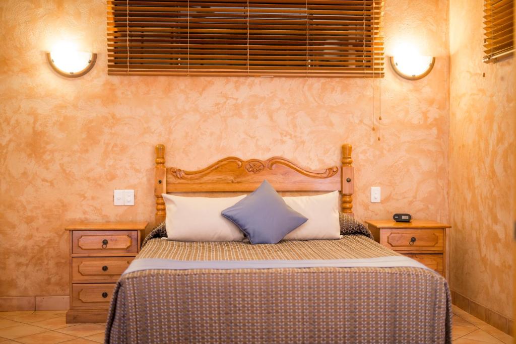 Postel nebo postele na pokoji v ubytování Blue Seas Resort