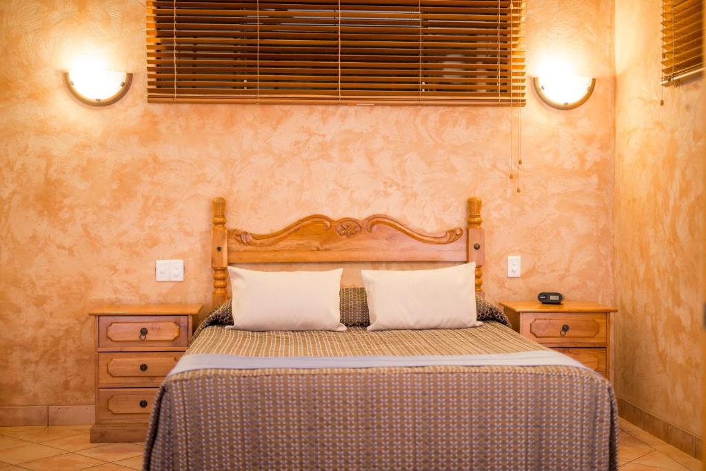 Postel nebo postele na pokoji v ubytování Blue Seas Resort