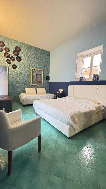 Postel nebo postele na pokoji v ubytování Suites Edivino Design Capri