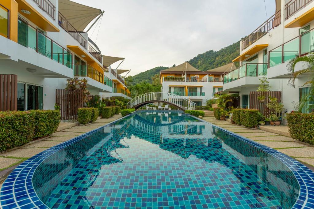 a swimming pool in the middle of a building at V69 15min Convenient to Patong Building Gym in Kamala Beach