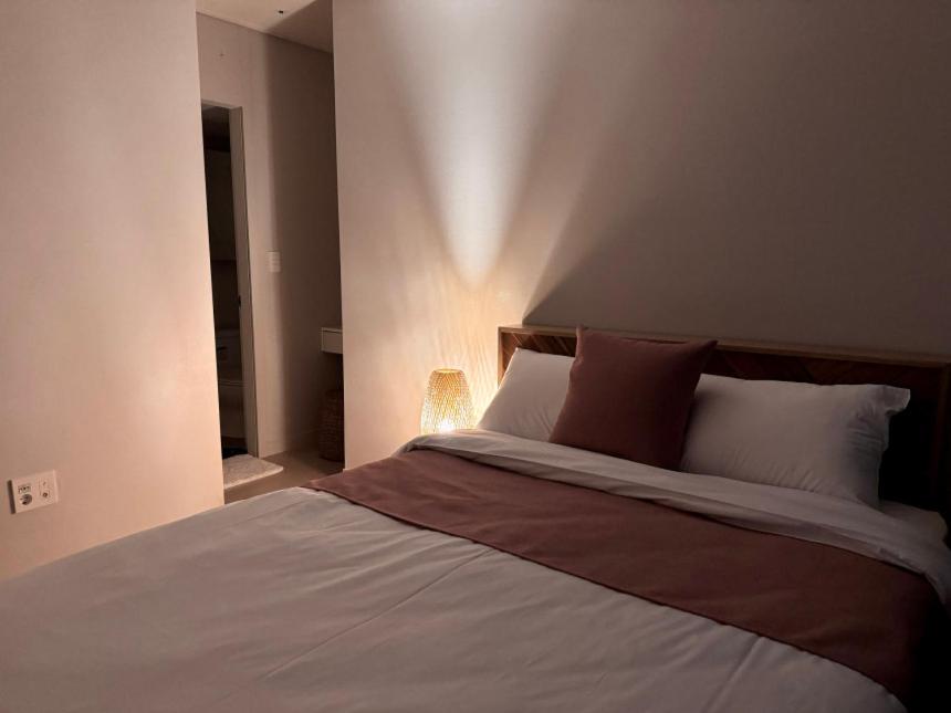 Letto o letti in una camera di Eunhasu D&M Residence