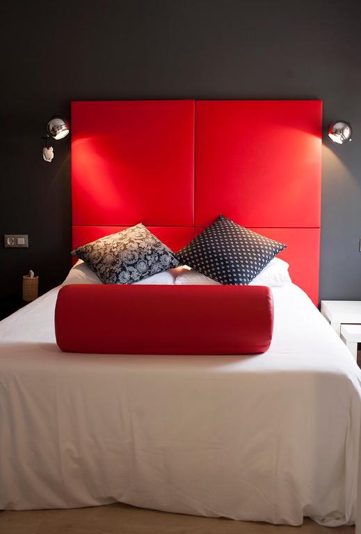 Postel nebo postele na pokoji v ubytování Hostal Totsompops