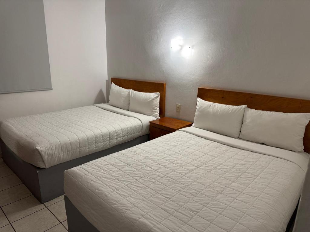 Postel nebo postele na pokoji v ubytování Hotel Posada Real