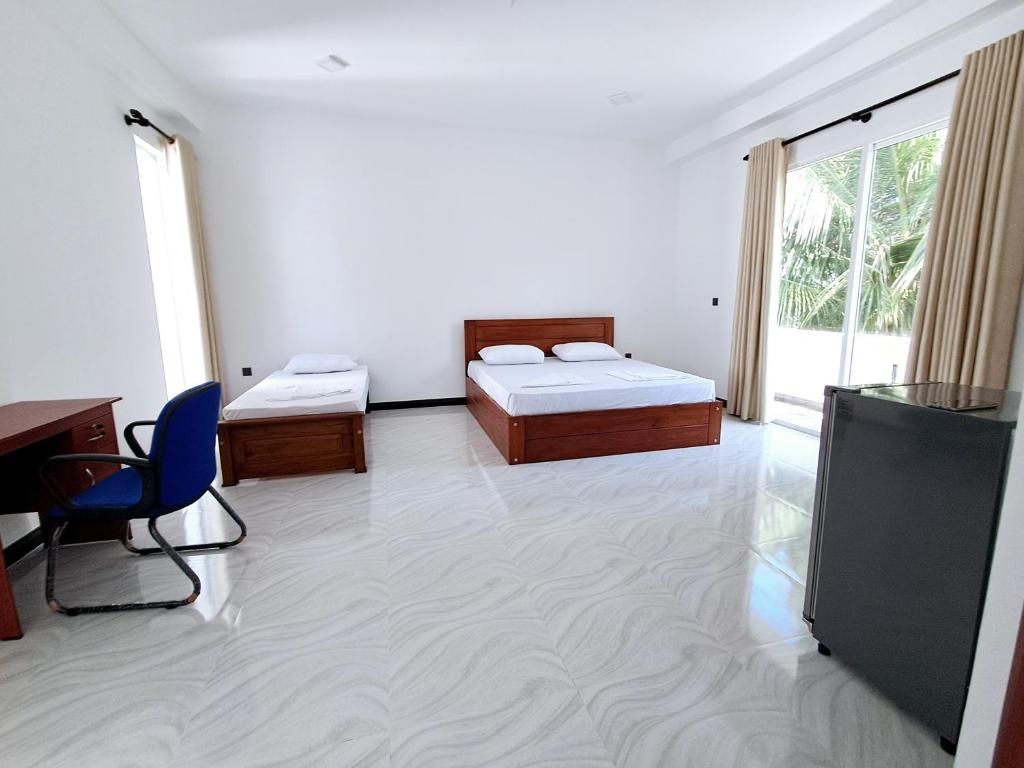 Giường trong phòng chung tại Fortress Holiday Apartments