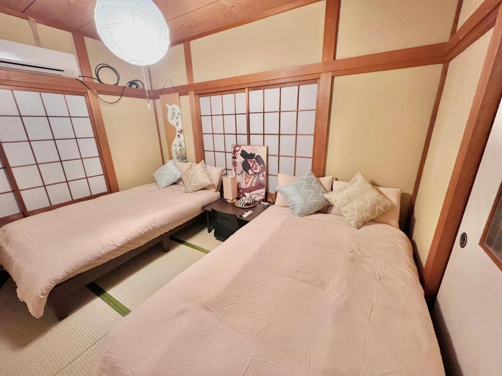 Postel nebo postele na pokoji v ubytování 千住4丁目1階 日本の和のお部屋スカイツリー9分秋葉原10分浅草12分