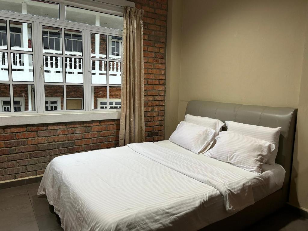 Postel nebo postele na pokoji v ubytování Kundasang Guesthouse