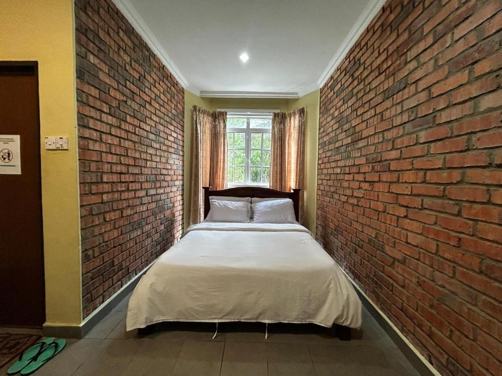 Postel nebo postele na pokoji v ubytování Kundasang Guesthouse