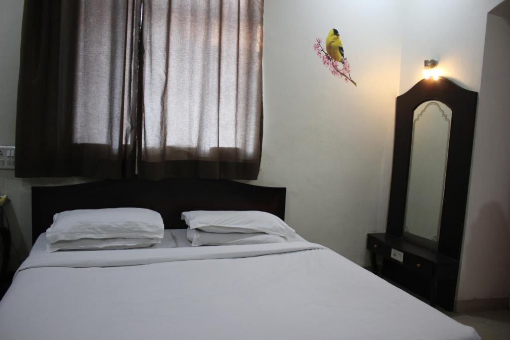 Postel nebo postele na pokoji v ubytování Hotel Ritz
