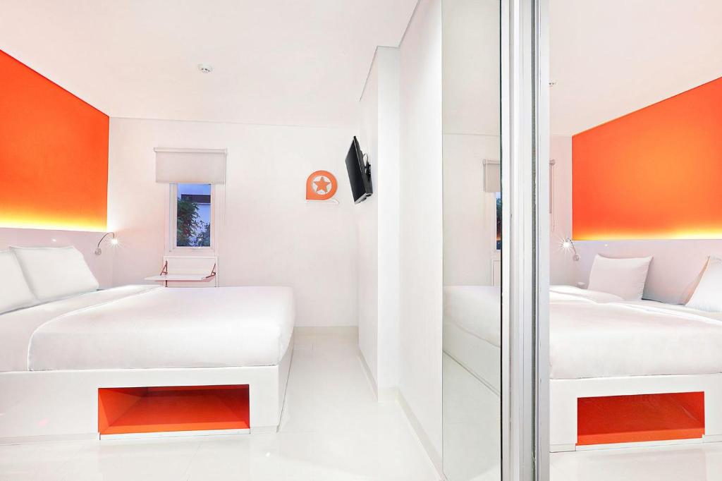 Voodi või voodid majutusasutuse Starlet Hotel Serpong toas