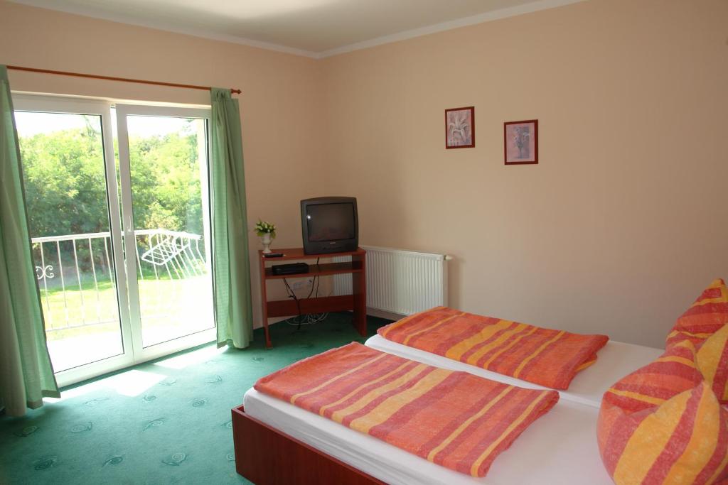 Postel nebo postele na pokoji v ubytování Balla Appartements