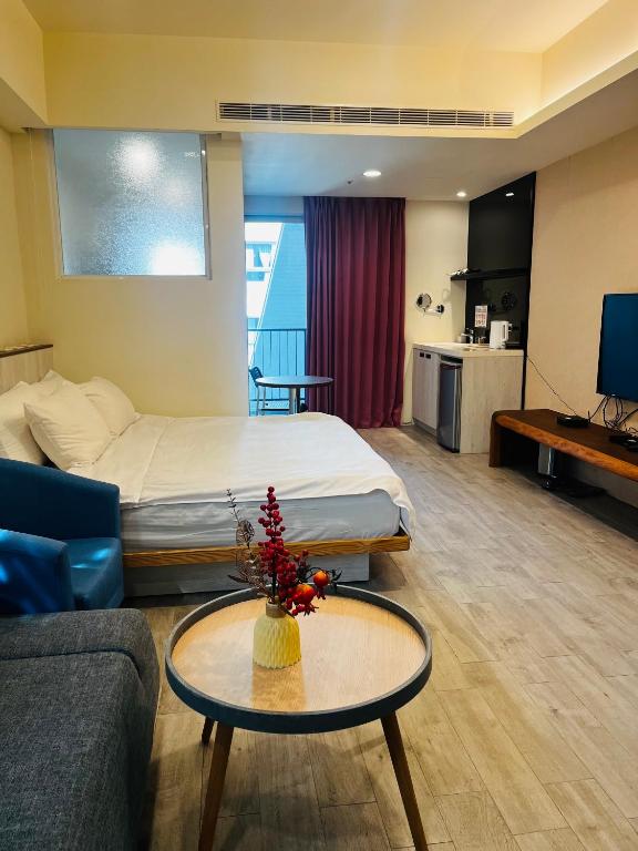 Giường trong phòng chung tại 愛麗徠綜合文旅會館