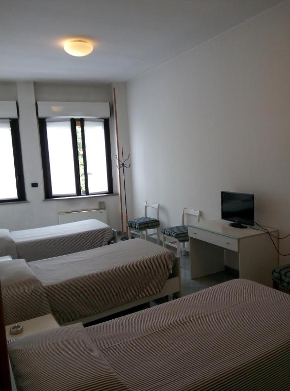 Televízia a/alebo spoločenská miestnosť v ubytovaní Hotel Cristallo