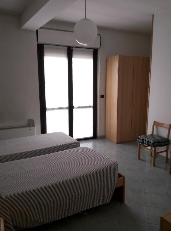 Posteľ alebo postele v izbe v ubytovaní Hotel Cristallo