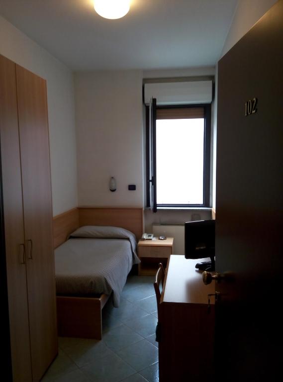 Posteľ alebo postele v izbe v ubytovaní Hotel Cristallo