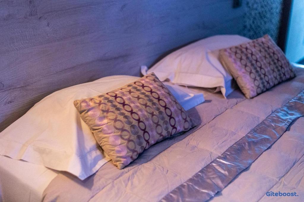 Postel nebo postele na pokoji v ubytování Le Val des Sens