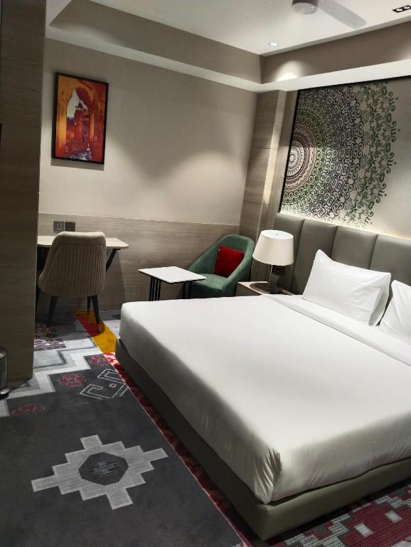 Postel nebo postele na pokoji v ubytování Crystal Inn
