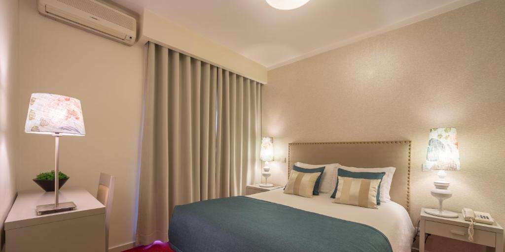Cama ou camas em um quarto em Hotel Lagoa dos Pastorinhos