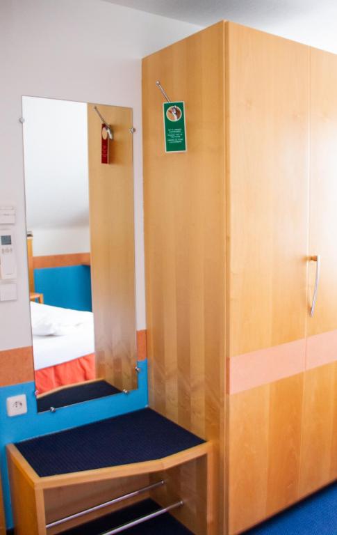 Postel nebo postele na pokoji v ubytování Hotel-Restaurant Steuermann