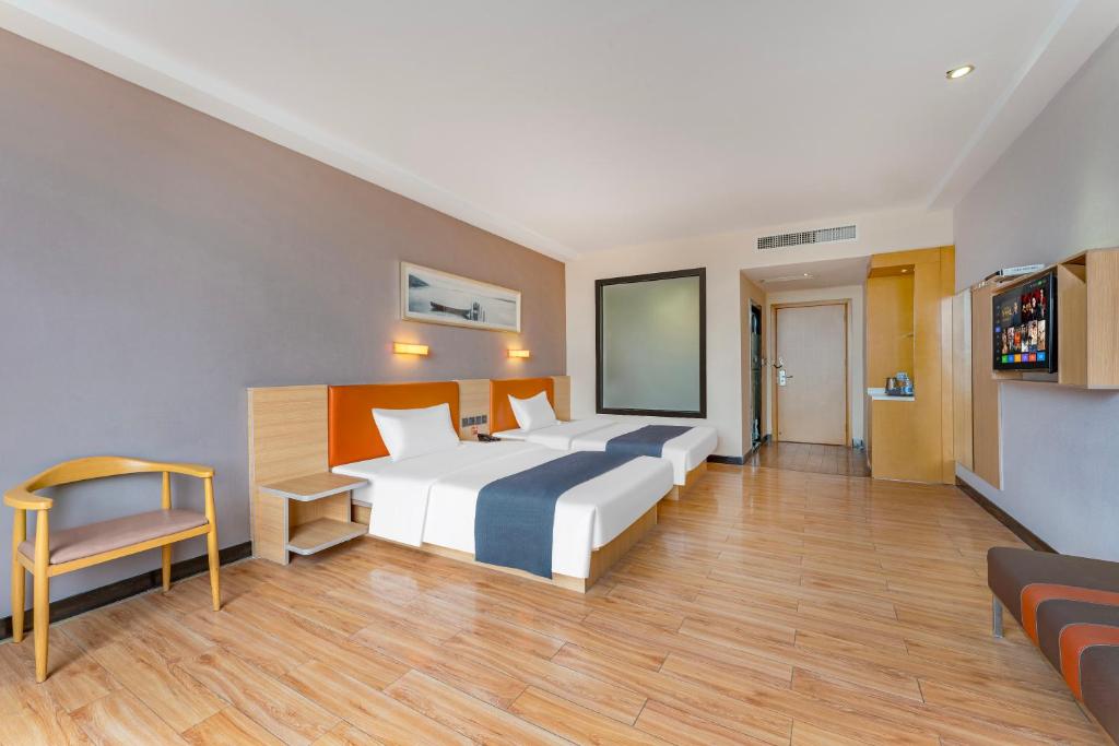 Postel nebo postele na pokoji v ubytování Yunli Boutique Hotel