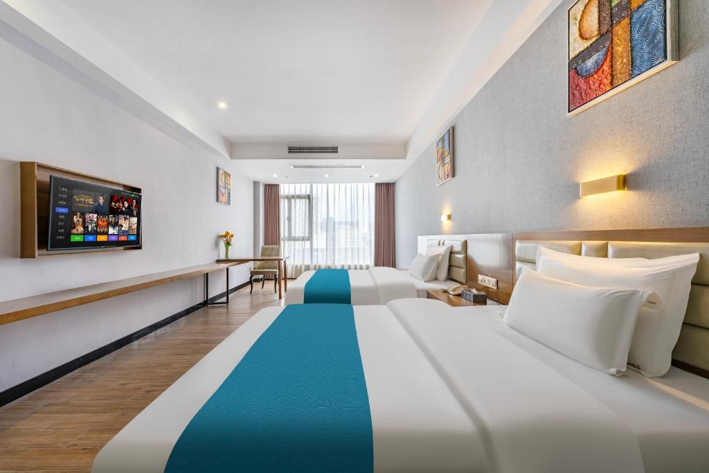 Postel nebo postele na pokoji v ubytování Yunli Boutique Hotel
