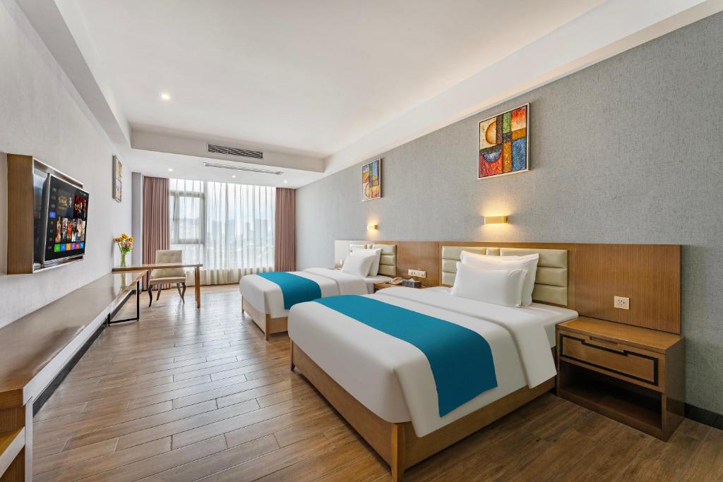 Postel nebo postele na pokoji v ubytování Yunli Boutique Hotel