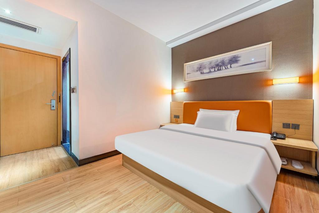 Postel nebo postele na pokoji v ubytování Yunli Boutique Hotel