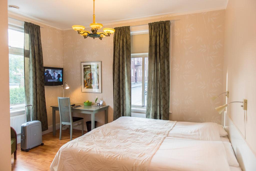 Postel nebo postele na pokoji v ubytování SPiS Hotell Amber
