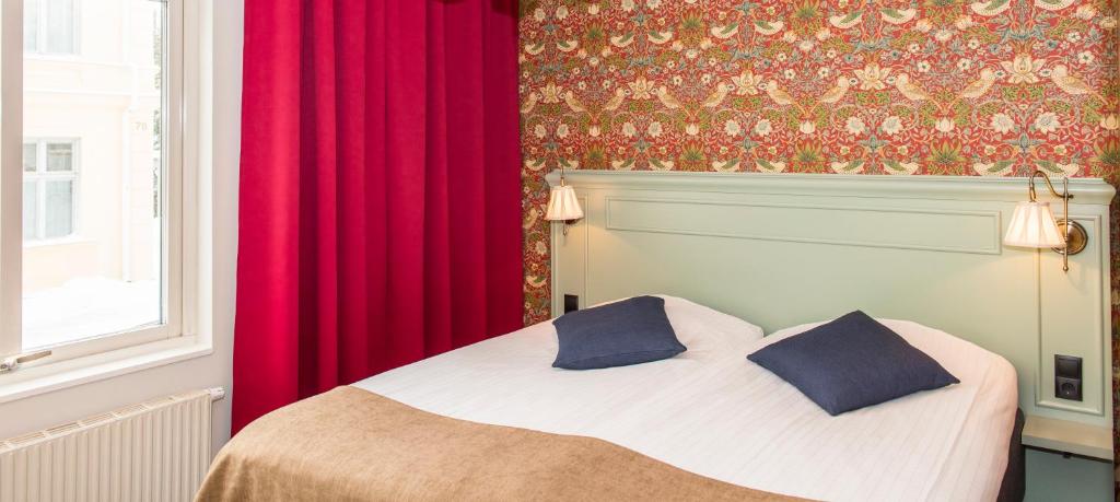 Postel nebo postele na pokoji v ubytování SPiS Hotell Amber