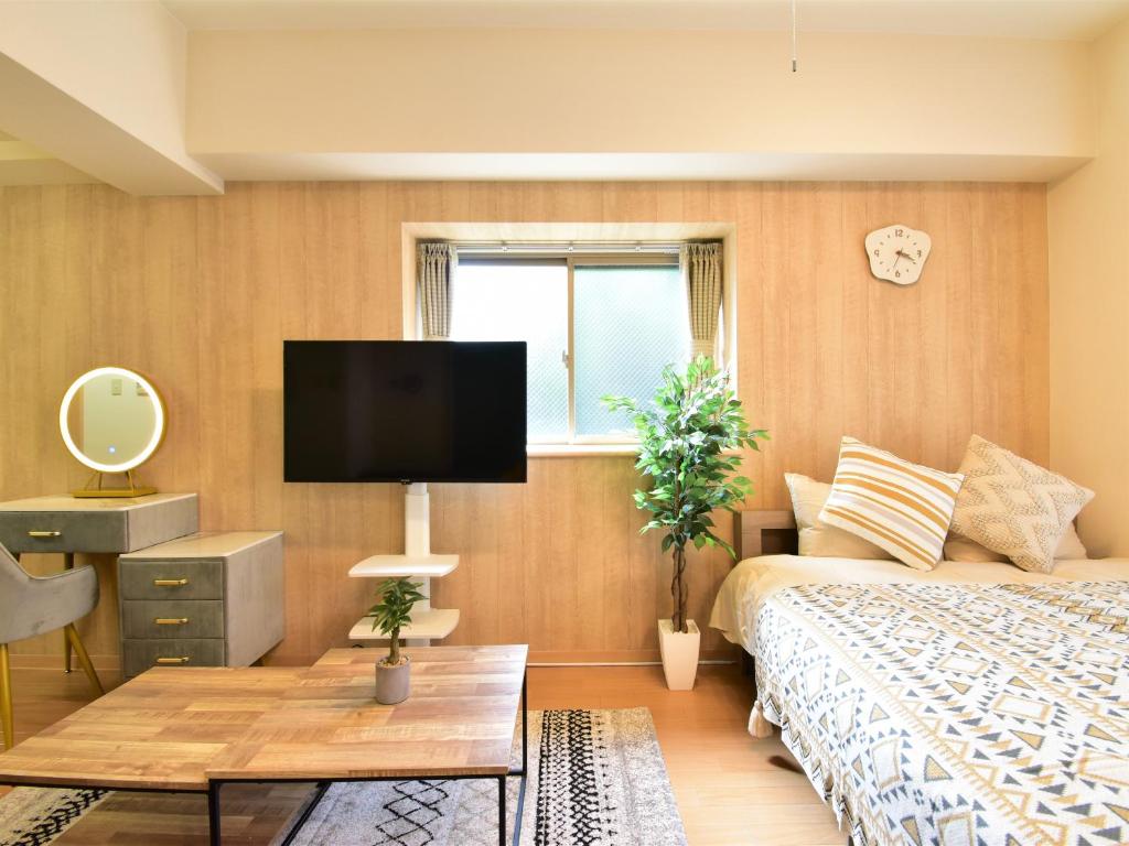 Postel nebo postele na pokoji v ubytování Alphabed福山西桜町