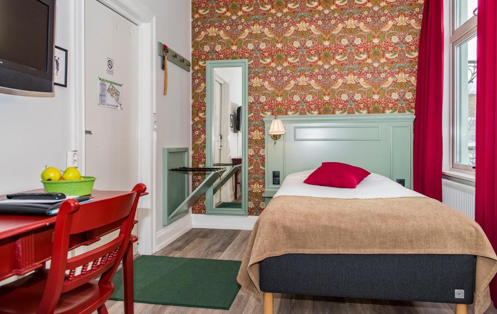 Postel nebo postele na pokoji v ubytování SPiS Hotell Amber