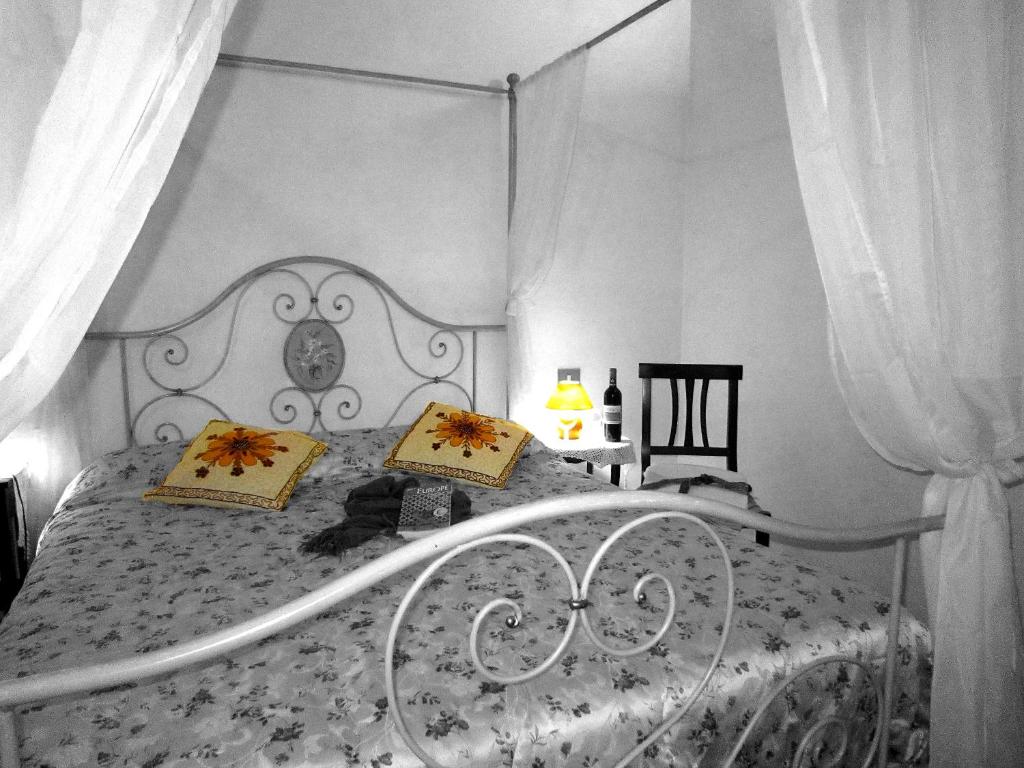 Postel nebo postele na pokoji v ubytování B&B Le Logge Di Sopra