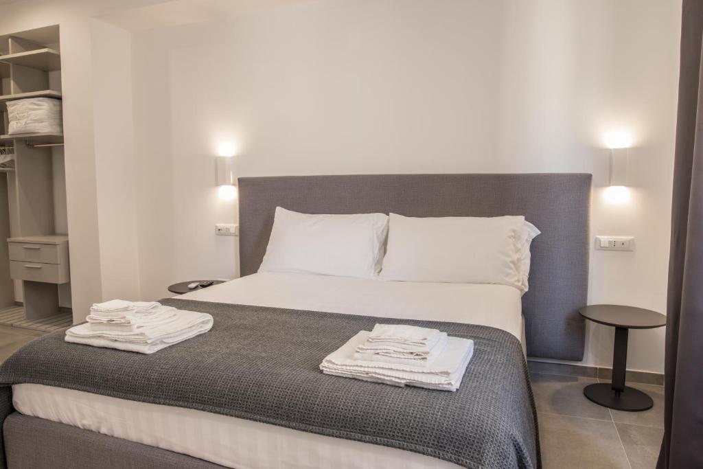 Posteľ alebo postele v izbe v ubytovaní SuitesGaribaldi