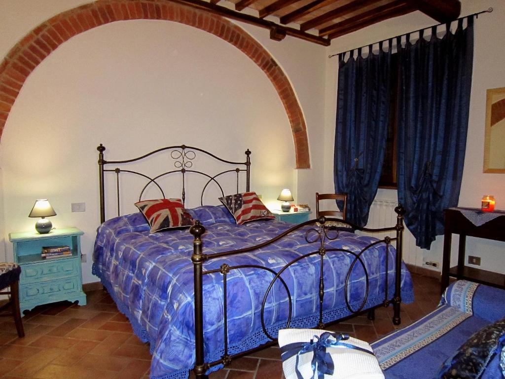 Postel nebo postele na pokoji v ubytování B&B Le Logge Di Sopra