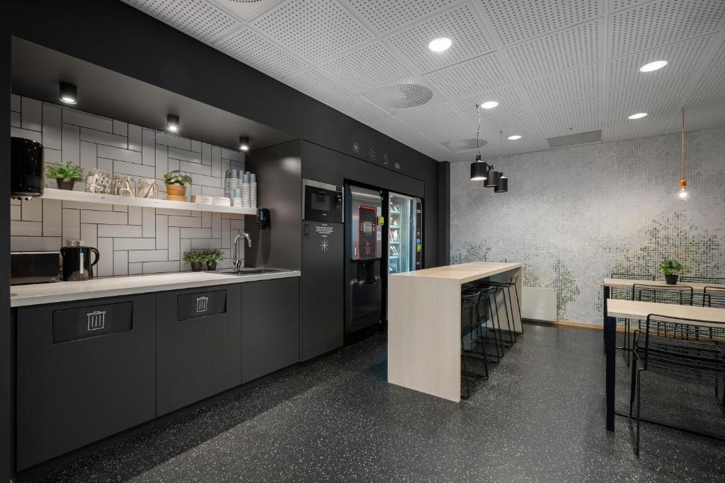 Kuchyň nebo kuchyňský kout v ubytování Citybox Bergen City