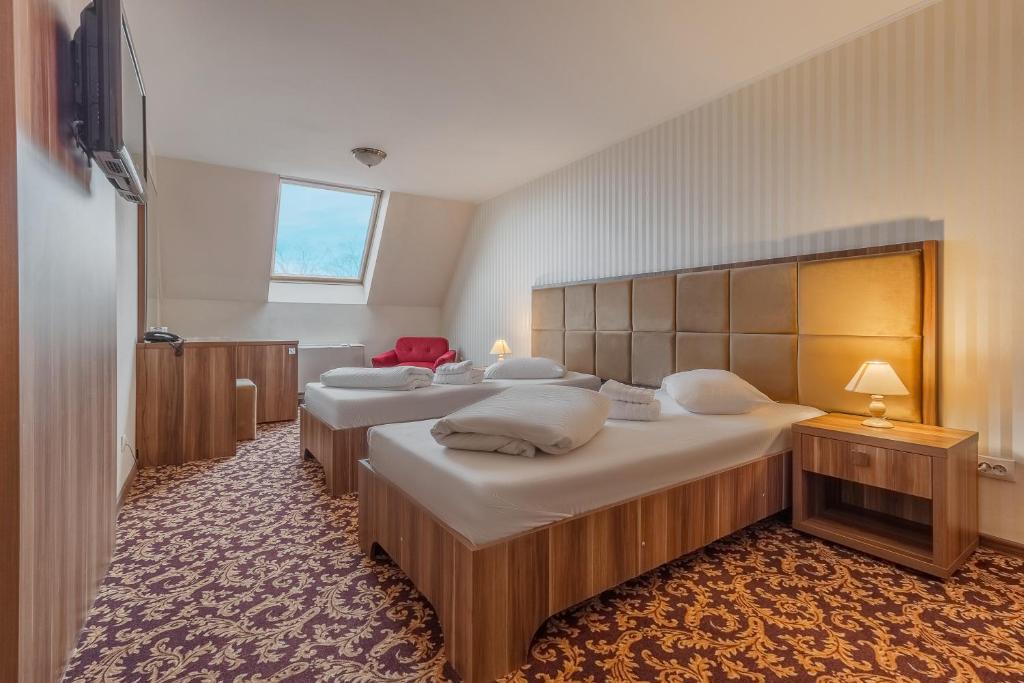 Postel nebo postele na pokoji v ubytování Hotel Impero