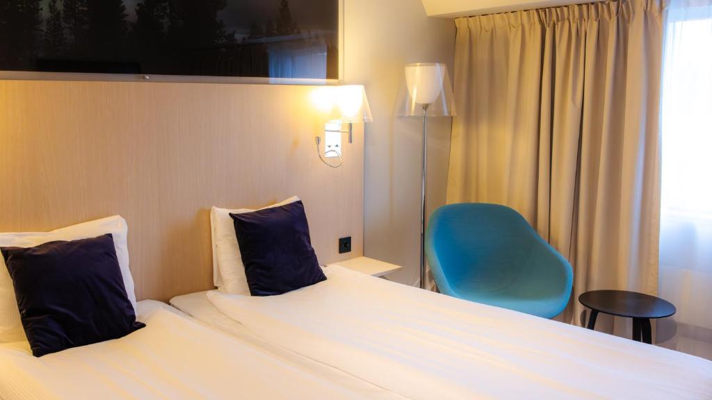 Postel nebo postele na pokoji v ubytování Quality Hotel Sundsvall