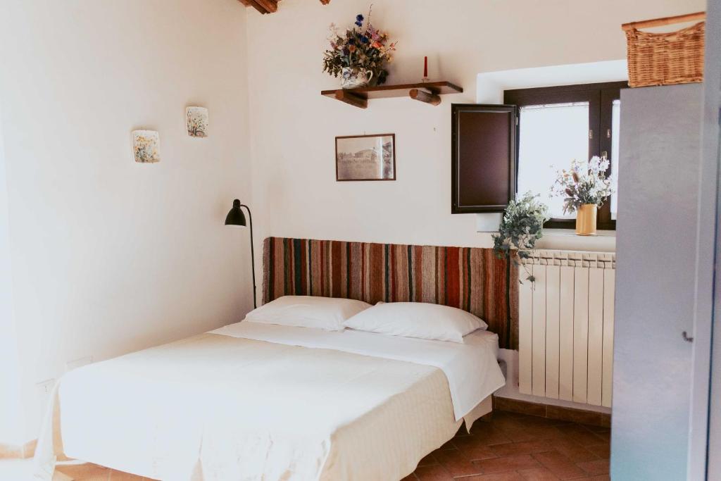 A bed or beds in a room at Bicoca - Casaletti