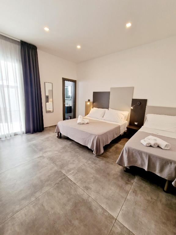 Postel nebo postele na pokoji v ubytování Marebed Apartments & Rooms