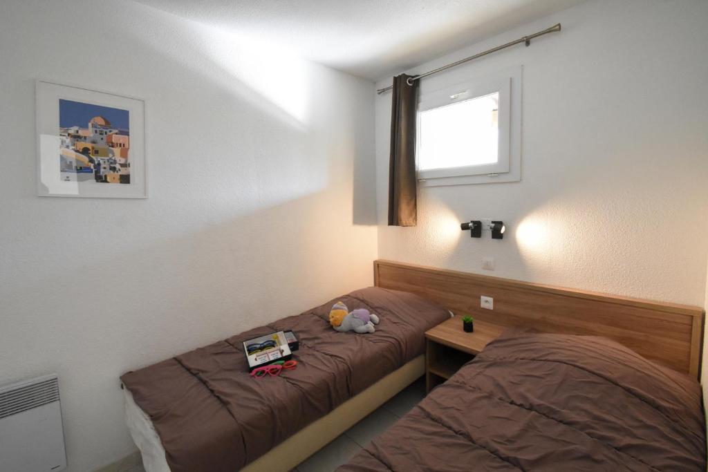 Postel nebo postele na pokoji v ubytování Residence La Palmeraie